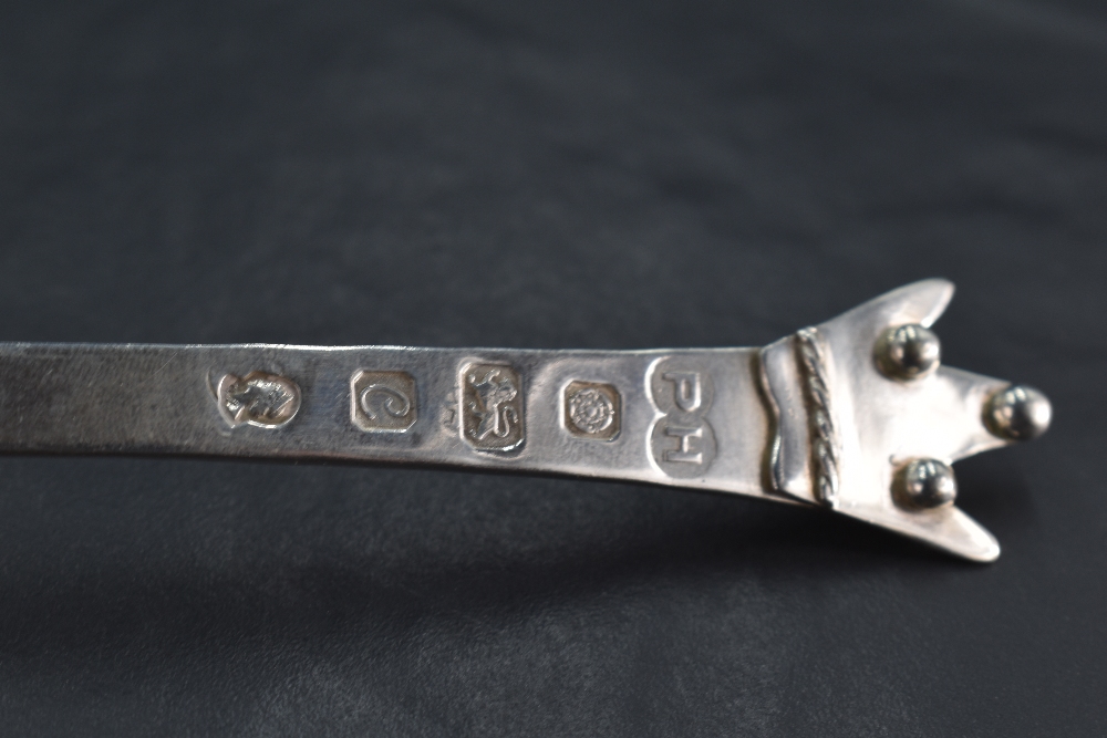 An unusual Queen Elizabeth II silver spoon, having an ovoid bowl, the plain shaped stem surmounted - Image 2 of 3