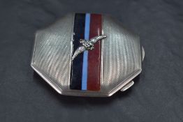 A George VI silver military interest powder compact, of octagonal for, with engine-turned surface