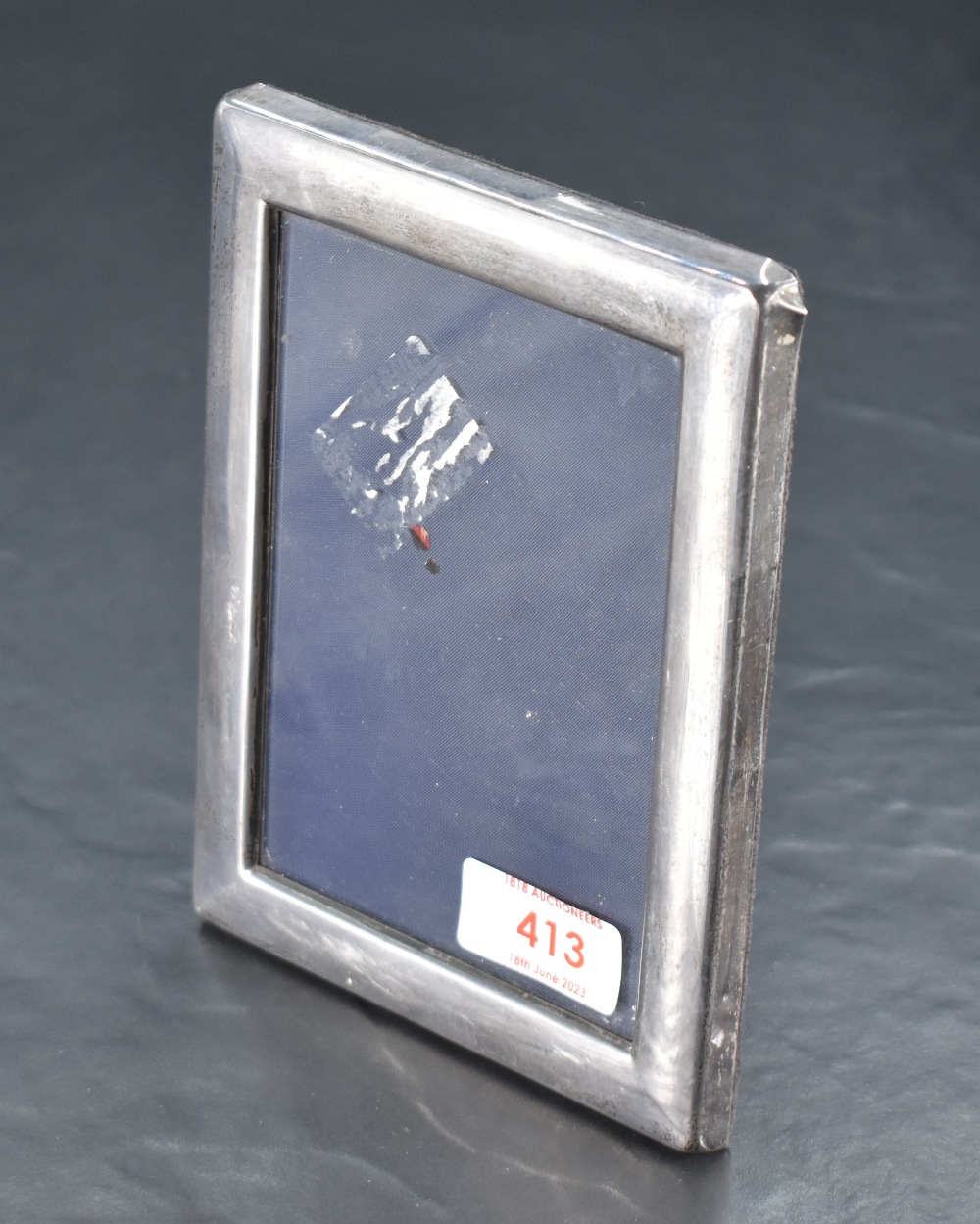 A Queen Elizabeth II silver photograph frame, of rectangular form with marks for Sheffield 1988,