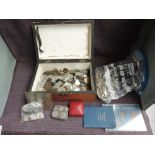 A collection of World Coins including a small amount of Silver, modern Crowns, tin Coin Holder,