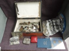 A collection of World Coins including a small amount of Silver, modern Crowns, tin Coin Holder,