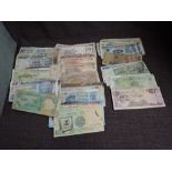 A collection of used World Banknotes including India, China, Vietnam, Romania, Malaysia, Mexico,