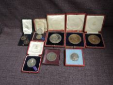 A collection of Royalty Medallions in cases, cases (af), Silver & Bronze including Alexandra