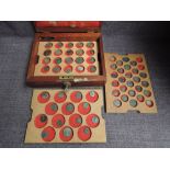 A wooden lockable case containing three trays of Roman Coins and one Hammered Coin, 60 in total