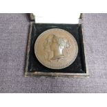 A Bronze International Exhibition 1851 Prize Medal, Female figure seated crowning kneeling figure,