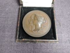 A Bronze International Exhibition 1851 Prize Medal, Female figure seated crowning kneeling figure,
