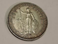 A 1911 Silver Trade One Dollar in capsule