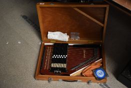 A vintage Zither-Auto harp in wooden case