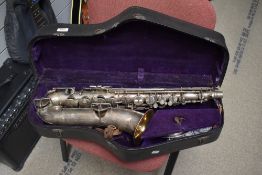 A vintage alto saxophone , stamped Buescher, Elkhart , low pitch true tone and serial number 102664