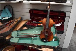 A traditional violin having two piece 14inch back, makers stamped on neck (mirroring Rs within