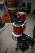 A four piece shell pack drum kit (no kick) with some stands etc, Pearl & Remo skins to the toms