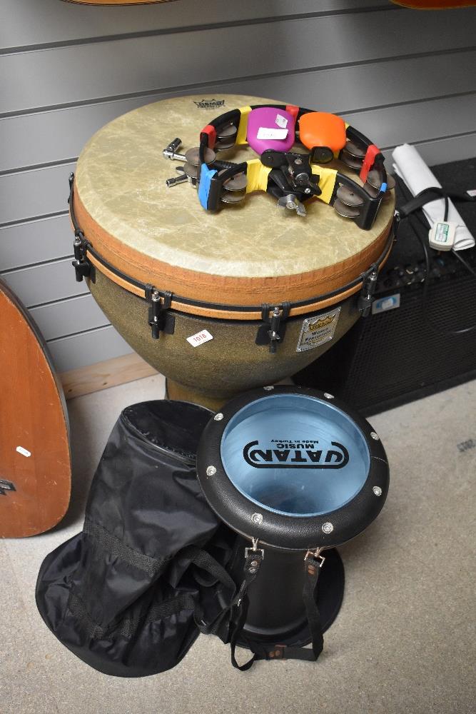 A Remo World Percussion Djembe , a Vatan music aluminium goblet drum, half moon tambourine with