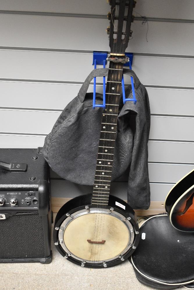 A Windsor Eclipse model 10 banjo (5 string but only 4 currently present) in denim style case