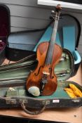A 19th Century violin having two piece 14inch back, unlabelled, signs of wear and re staining sold
