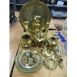 A selection of brass ware, including Indian Lassi cups, charger with traditional Indian scenes,