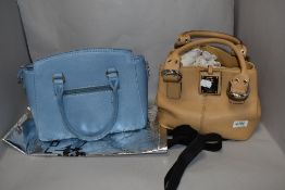 Two handbags, one of blue PVC by David Jones and the other beige leather by Tignanello, both
