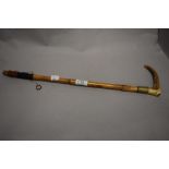 An early 20th century horn handled riding crop, having Eve Cook monogrammed to cuff.
