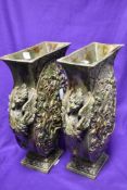 Two 20th century continental oval form vases, having mottled green glaze and moulded handles and