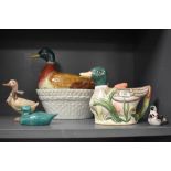 A novelty duck tea pot or jug, a egg basket of duck form and three similar ornaments.