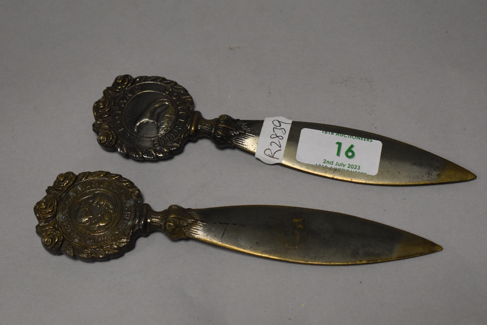 Two Victorian bronze handled Leopard Shirtings letter openers, both 16cm long