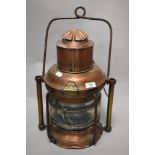 A 19th Century copper and brass ship's masthead lantern, with painted turned carrying handle, and
