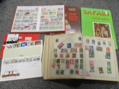 Two vintage stamp albums with some stamps, stamp collecting reference book and two souvenir