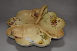 A Royal Worcester blush ivory serving dish, having three compartments and handles, dated to 1897.