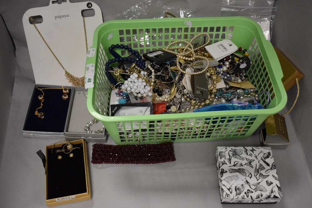 A basket of costume jewellery, pearl style necklaces, earrings, and other jewellery