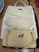 Two handbags, having DKNY metal emblem and labels, including nude tone quilted bag with chain handle