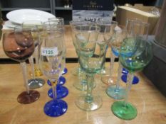 A mixed lot of glasses, including coloured glass mid century wine glasses.