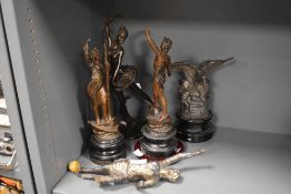 A collection of antique spelter figurines and a modern resin ballerina, AF.