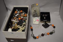 A box of mixed modern costume jewellery, some new with tags, including necklaces, earrings and