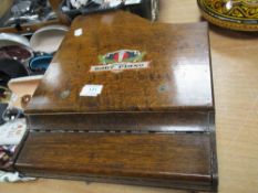 A vintage 1930s oak cased childs 'grand baby piano'.