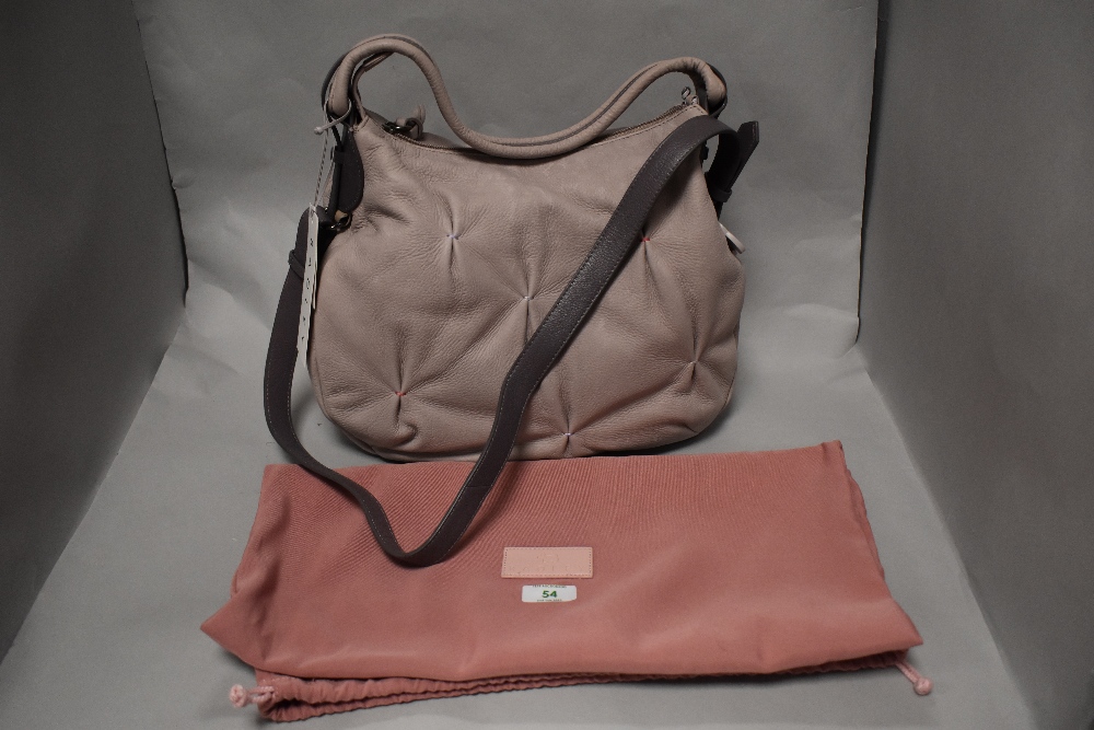 A Radley leather pale pink hand bag together with a drawstring bag