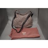 A Radley leather pale pink hand bag together with a drawstring bag