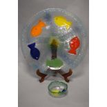 A colourful mid-late 20th Century art glass charger, decorated with bead eyed fish, diameter 40cm,