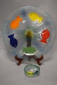 A colourful mid-late 20th Century art glass charger, decorated with bead eyed fish, diameter 40cm,