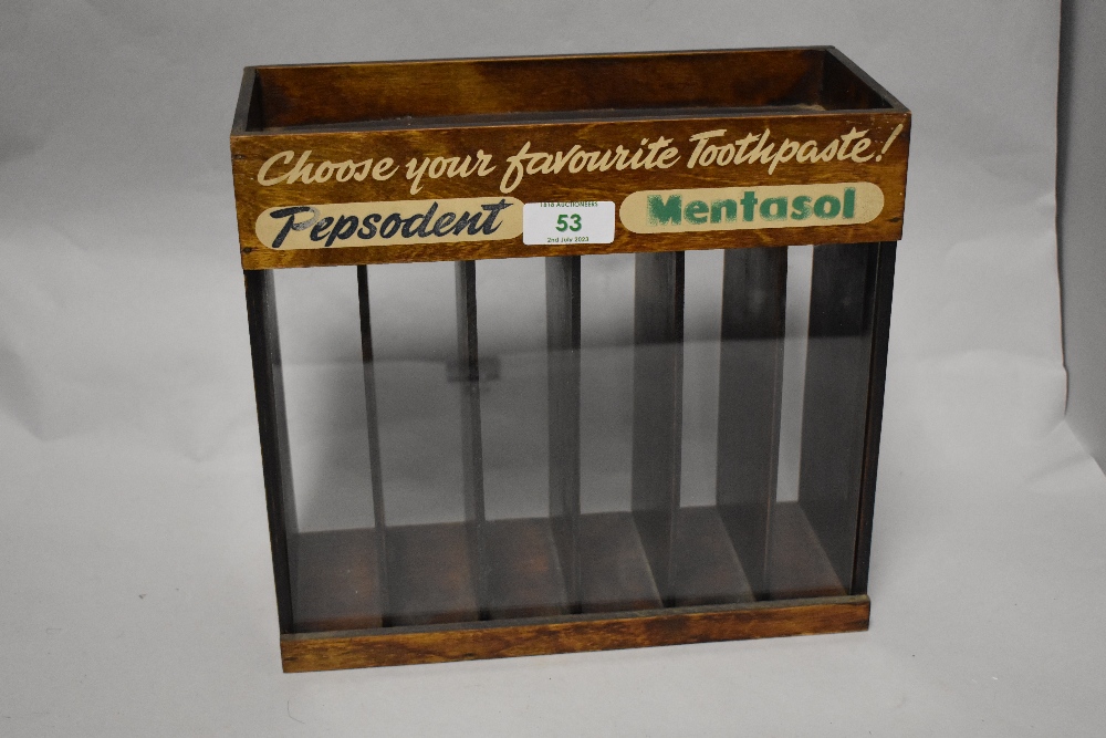 A vintage Pepsodent Mentasol six division advertising case with glass front, measuring 24cm x 26cm x