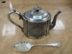 A silver plated tea pot having decorative finial, and a table spoon having embossed fruit design.