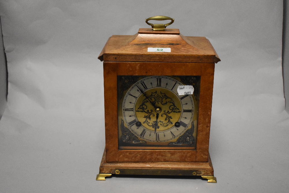 An early 20th Century bracket clock, having a two train movement, and housed within a walnut case