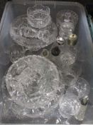 A mixed lot of cut glass, comprising; fruit bowls, glasses, bowls, candle sticks and more, also
