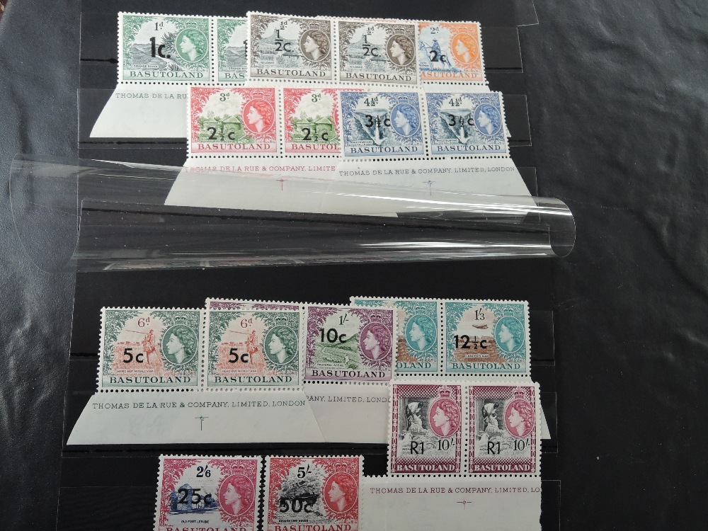 BASUTOLAND 1961, SURCHARGED SET OF 11, MOST MNH MARGINAL PAIRS Most we note have printers imprint to