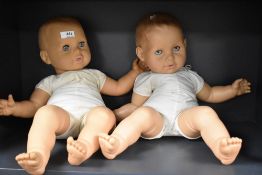 Two large soft bodied dolls.