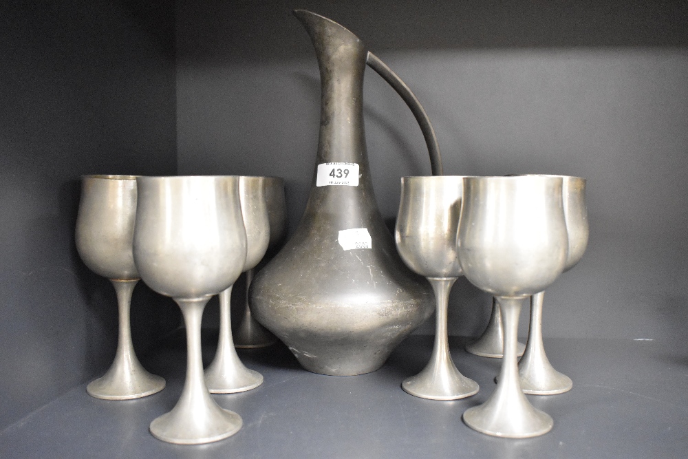 A Selango Pewter ewer and eight goblets.