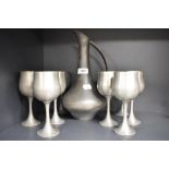 A Selango Pewter ewer and eight goblets.