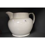 An over large white ceramic jug.