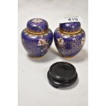 Two modern miniature cloisonné enamel ginger jars, of traditional design one retaining wooden stand