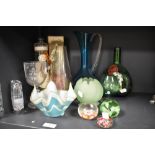 An assorted lot of glass, including Millefiori paperweights, vintage wine bottle, 1960s handkerchief