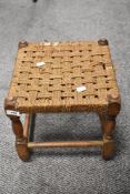 A small woven seated stool (AF).