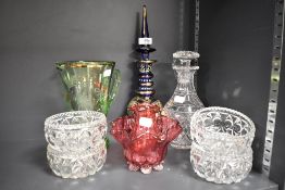 A bohemian decanter in cobalt blue with gilt decoration and knopped stem, an etched green glass